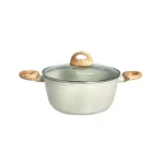 Juego de ollas de 11 piezas Finezza FZ-C1120ST de ultragranito negro con base para inducción y tapas de vidrio templado dispuestas ordenadamente sobre un fondo neutro.